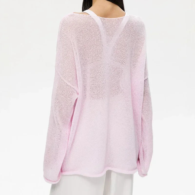 Maglia a trama larga, stile minimal chic, ampia vestibilità. Per le serate di Primavera